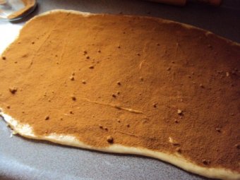 Cinnamon, butter and brown sugar sprinkled on dough