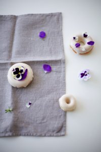 Homemade Doughnuts Decorated with Edible Pansies